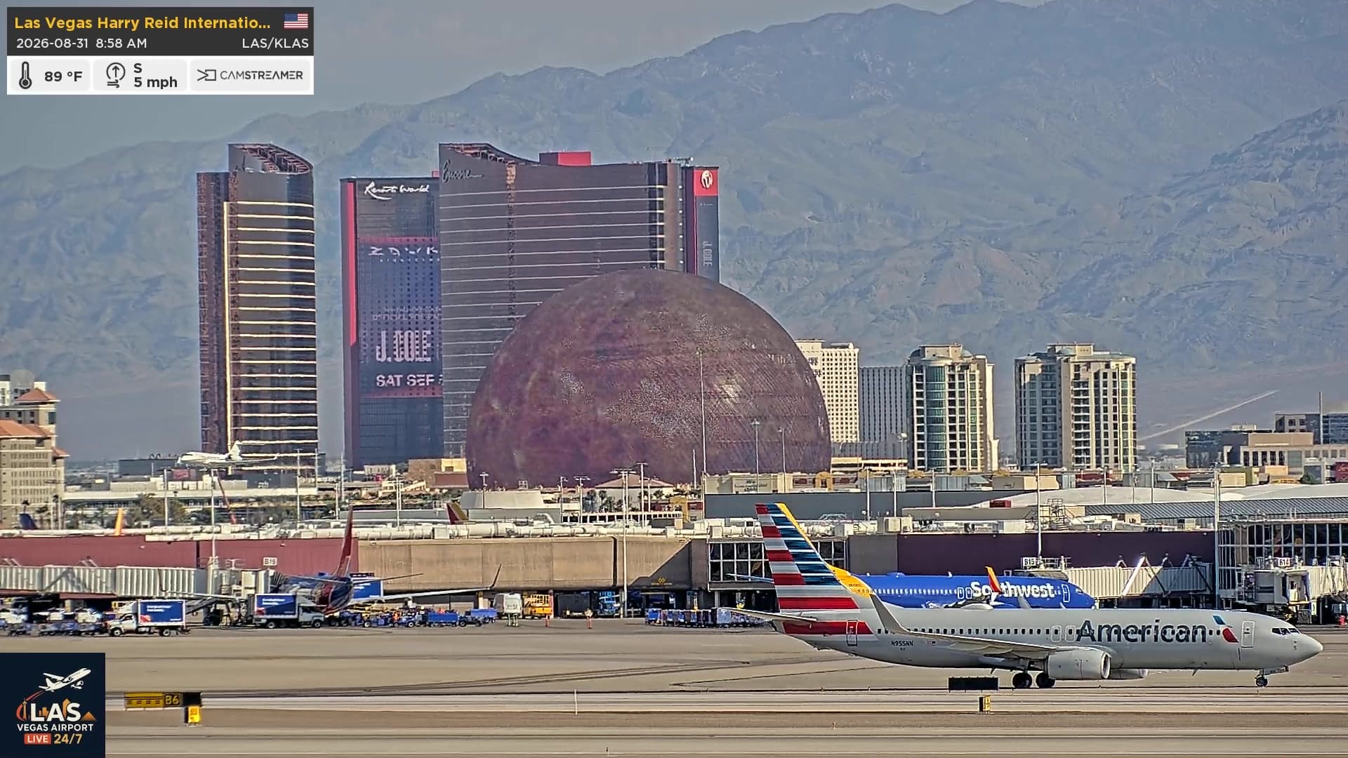 American Airlines jet at Las Vegas airport with the Sphere and Strip towers behind