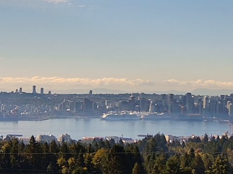 Downtown Vancouver skyline and Canada Place across Burrard Inlet on the live harbour webcam