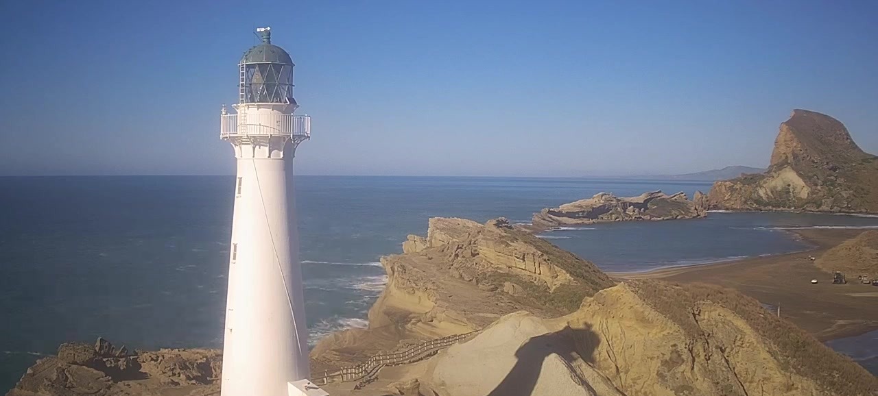 Castlepoint Lighthouse above the fossil reef and Castle Rock in New Zealand